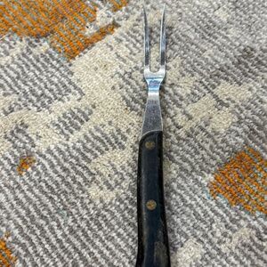 Large two prong stainless steel serving fork with wood handle made in Germany